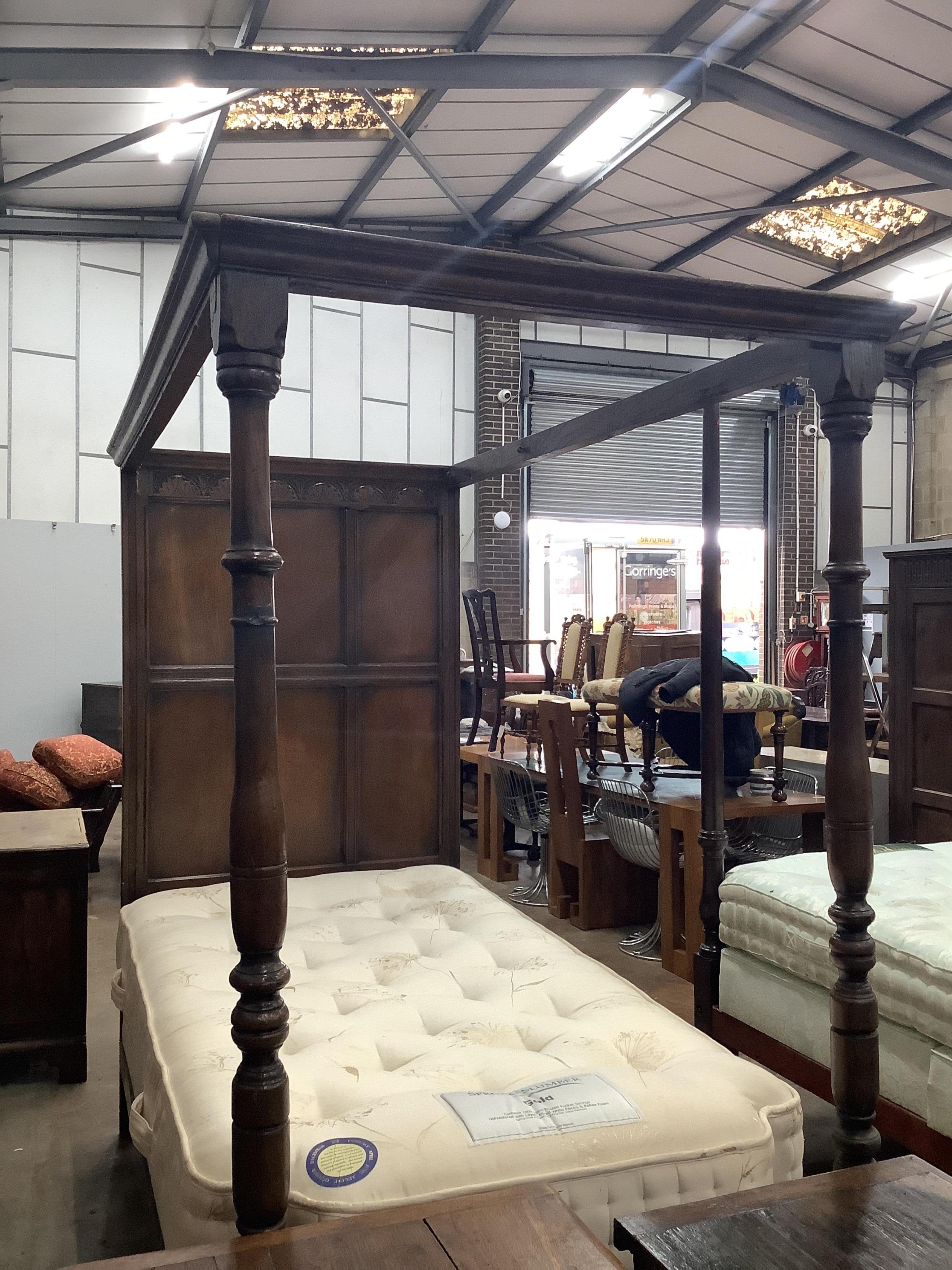 An 18th century style oak single four poster single bed frame, together with a mattress, width 107cm, length 215cm, height 104cm. Condition - fair to good